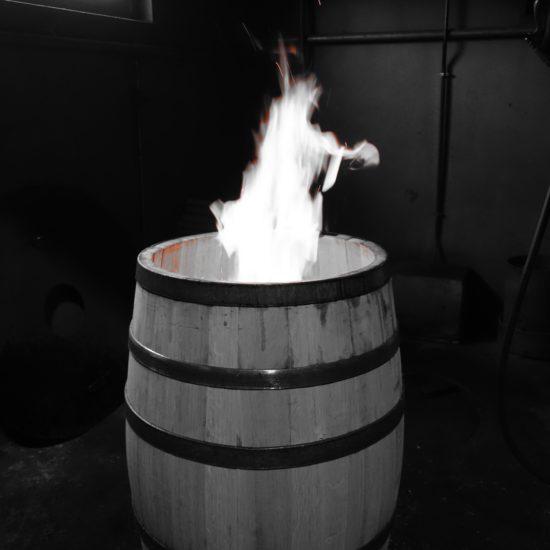 Barrel with flame coming out of it